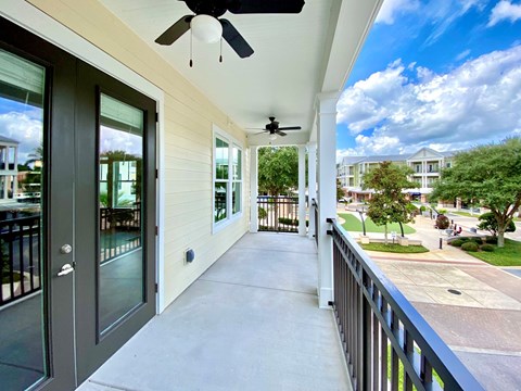 Apartment balcony view at The Flats at Tioga Town Center in Newberry, FL